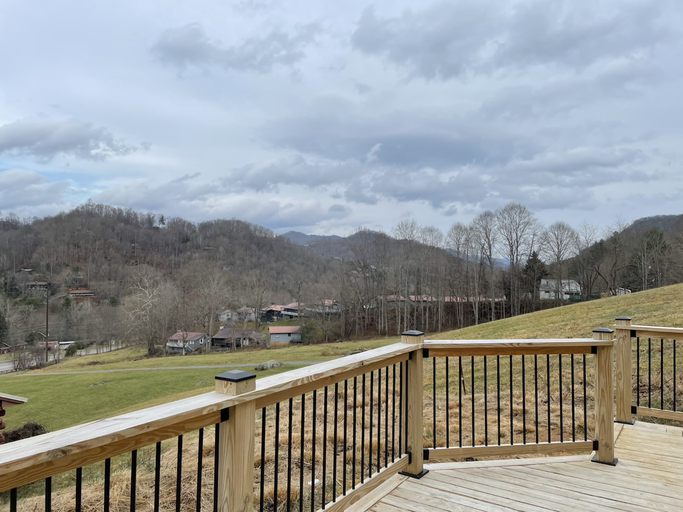 New deck with black metal balusters overlooking the valley