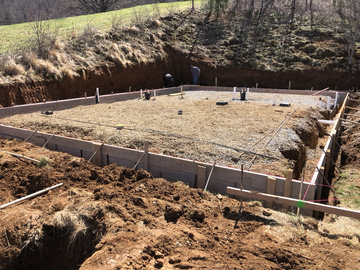 Footing forms set in a cut building pad