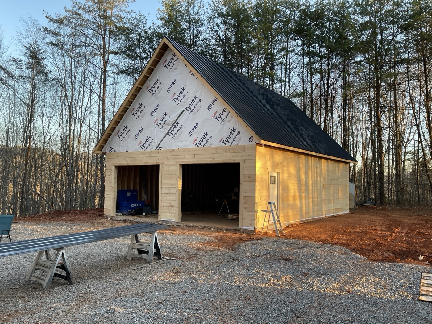 Two-bay garage framed and wrapped, roof on