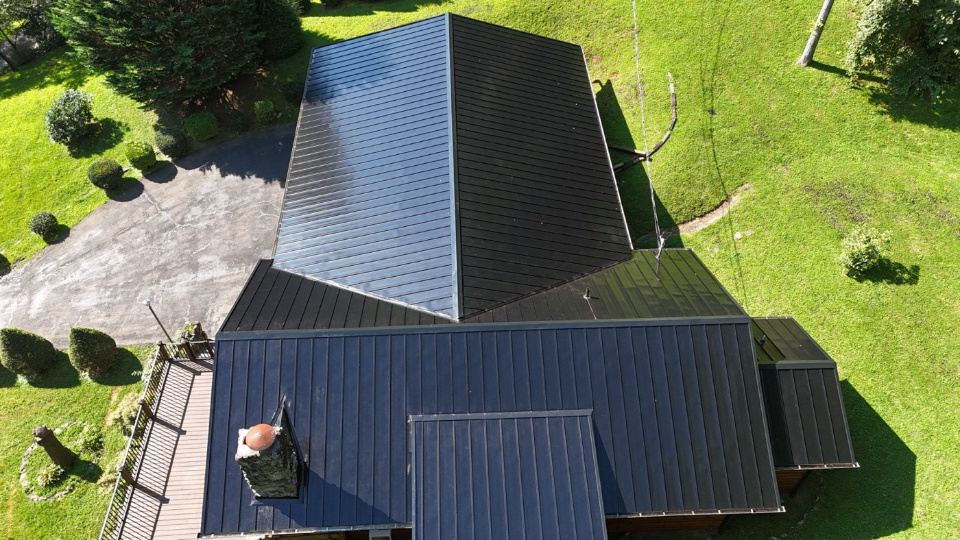 Aerial view of a finished dark metal roof